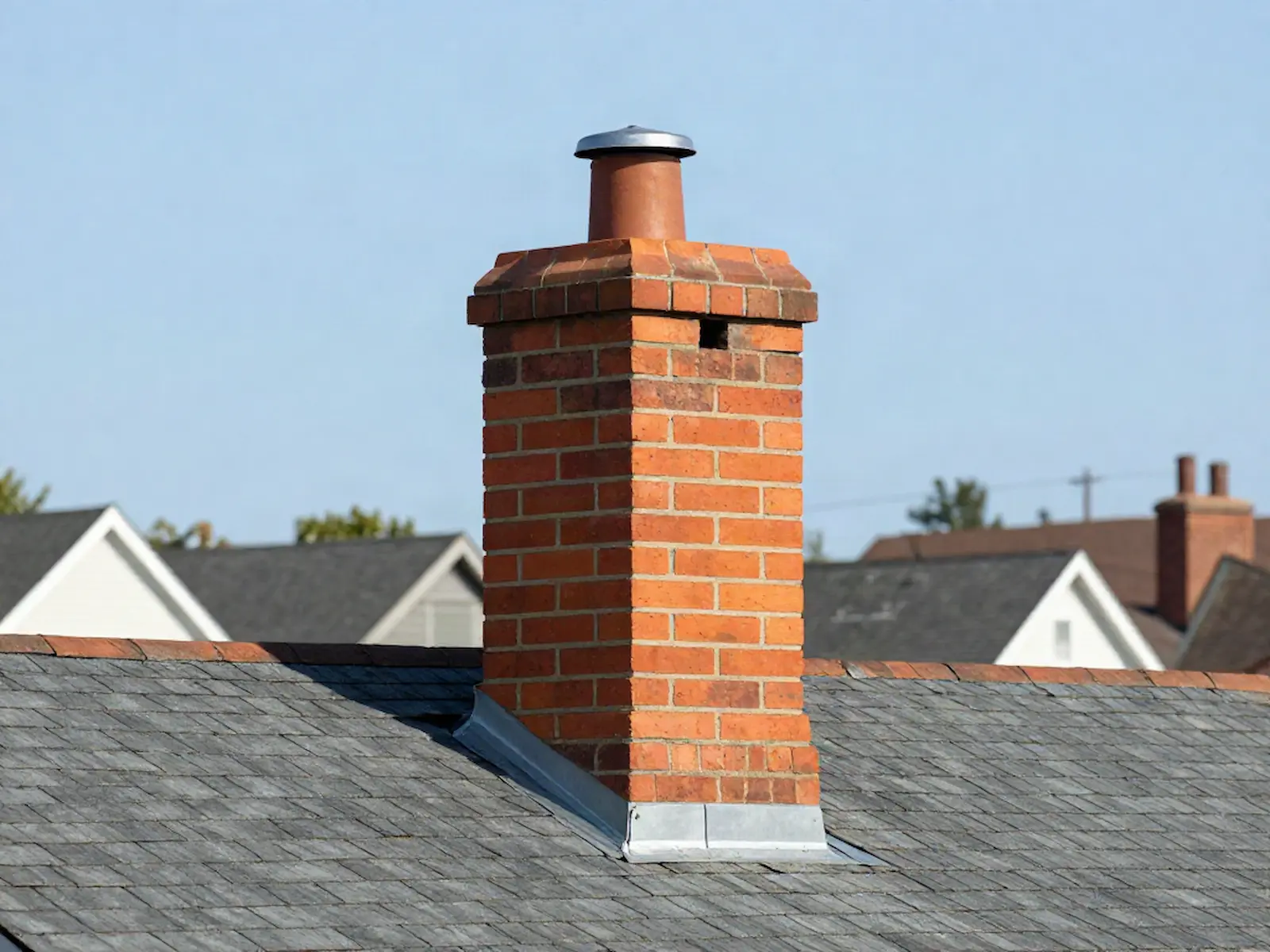 Brick chimney on a home served by Tall Pines Chimney Service Co. in Philadelphia, PA